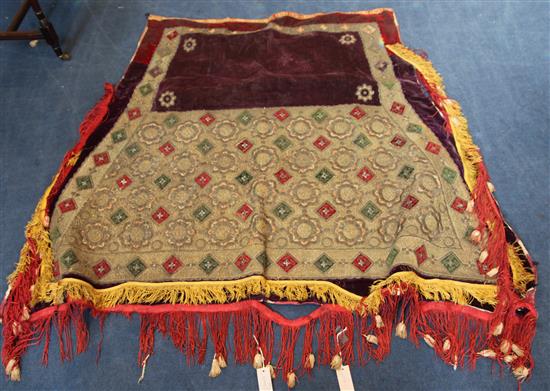 A Tibetan velvet and metal brocade saddle cloth or horse blanket